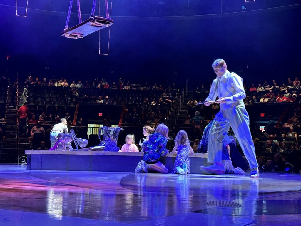 Picture shows audience participating in Cirque de Soleil's performance through image capturing